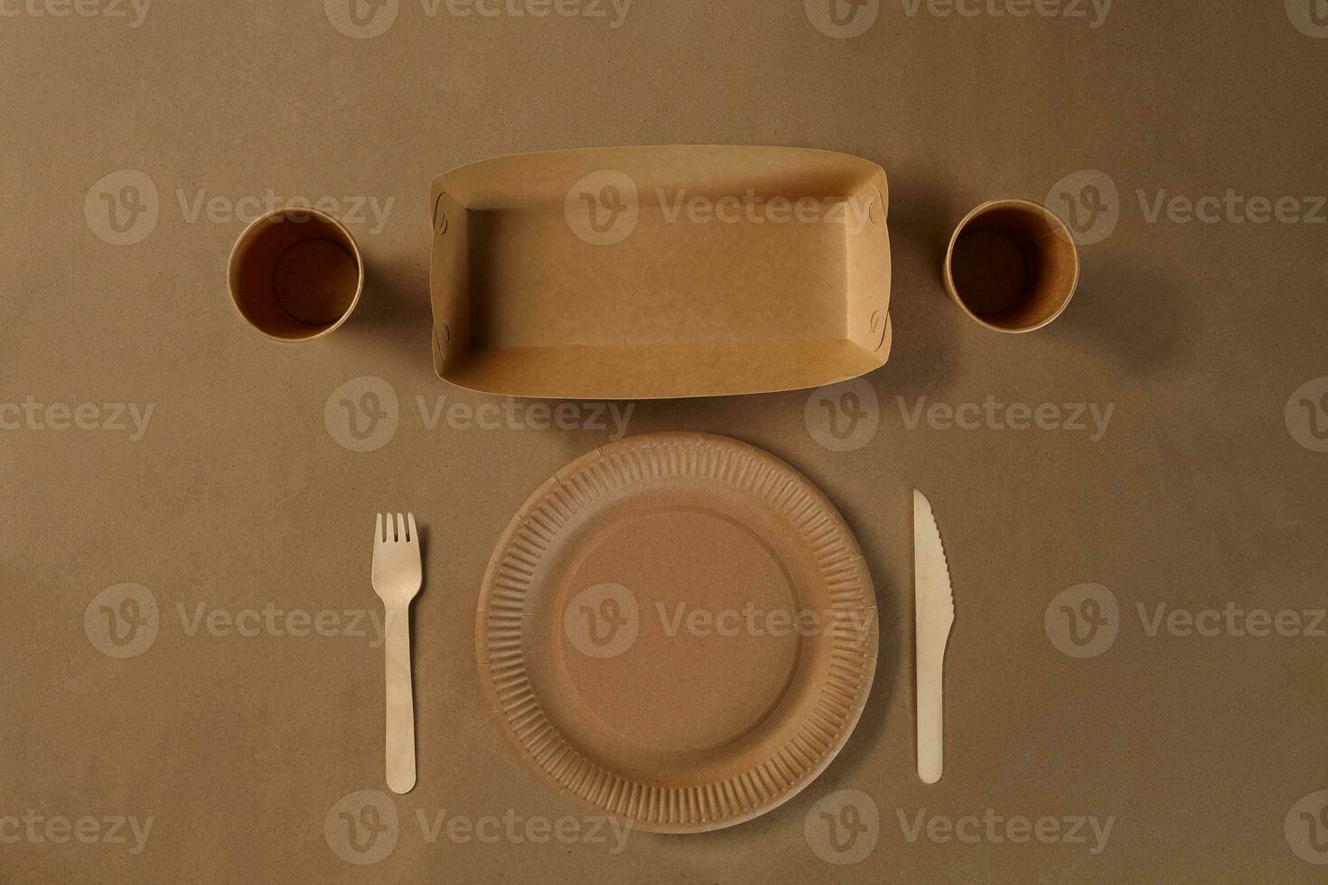 Eco friendly disposable tableware. Biodegradable craft dishes. Recycling concept. Also used in fast food, restaurants, takeaways, picnics. Close-up. photo