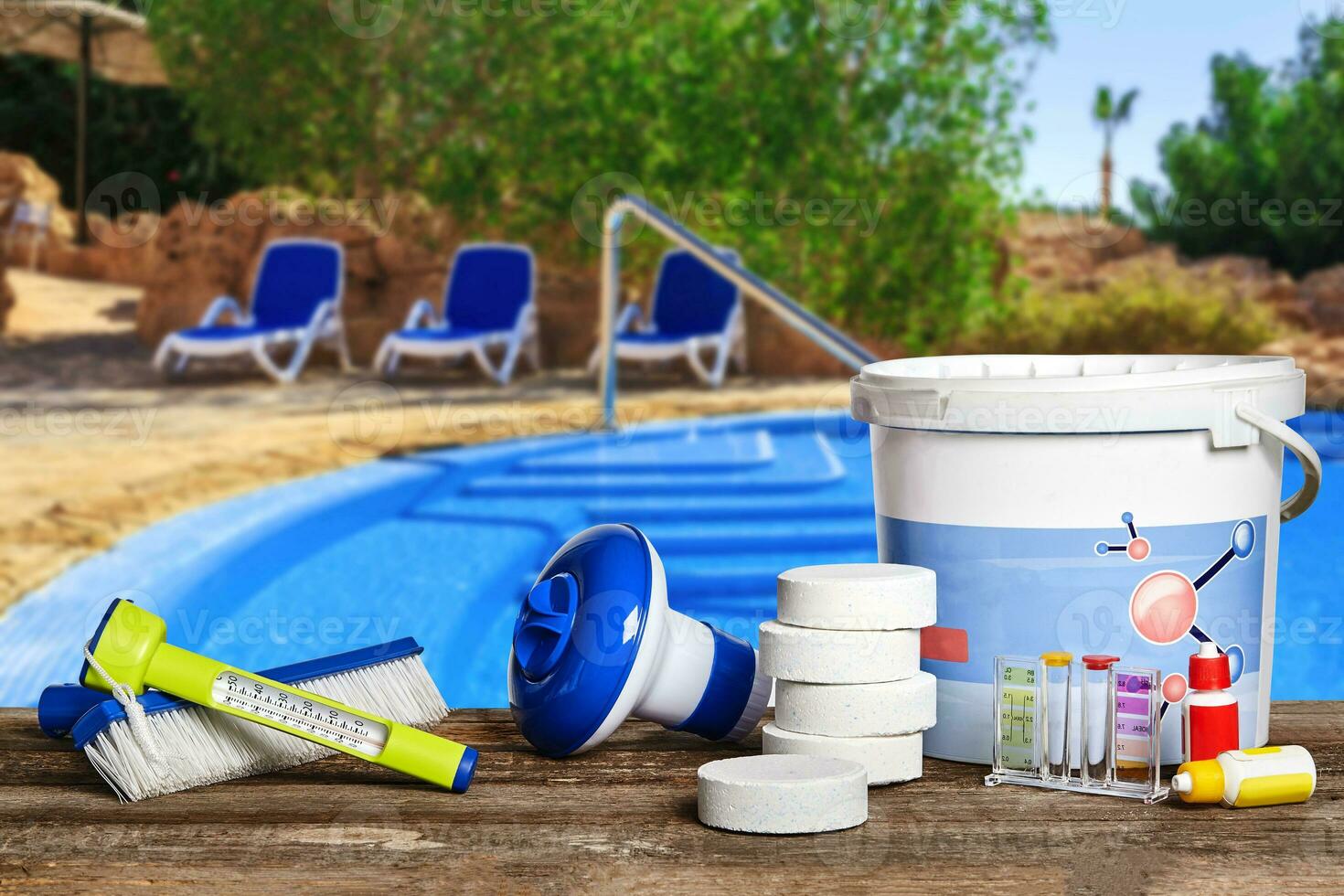Equipment with chemical cleaning products and tools for the maintenance of the swimming pool. photo