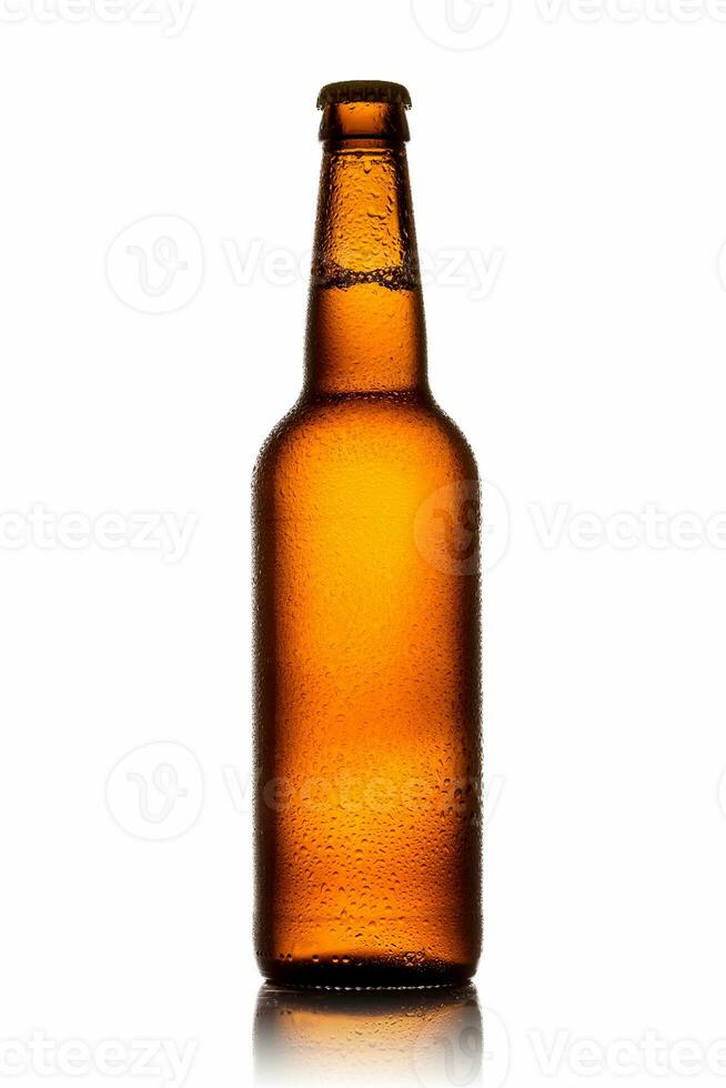 Bottle of beer with drops on white background. photo