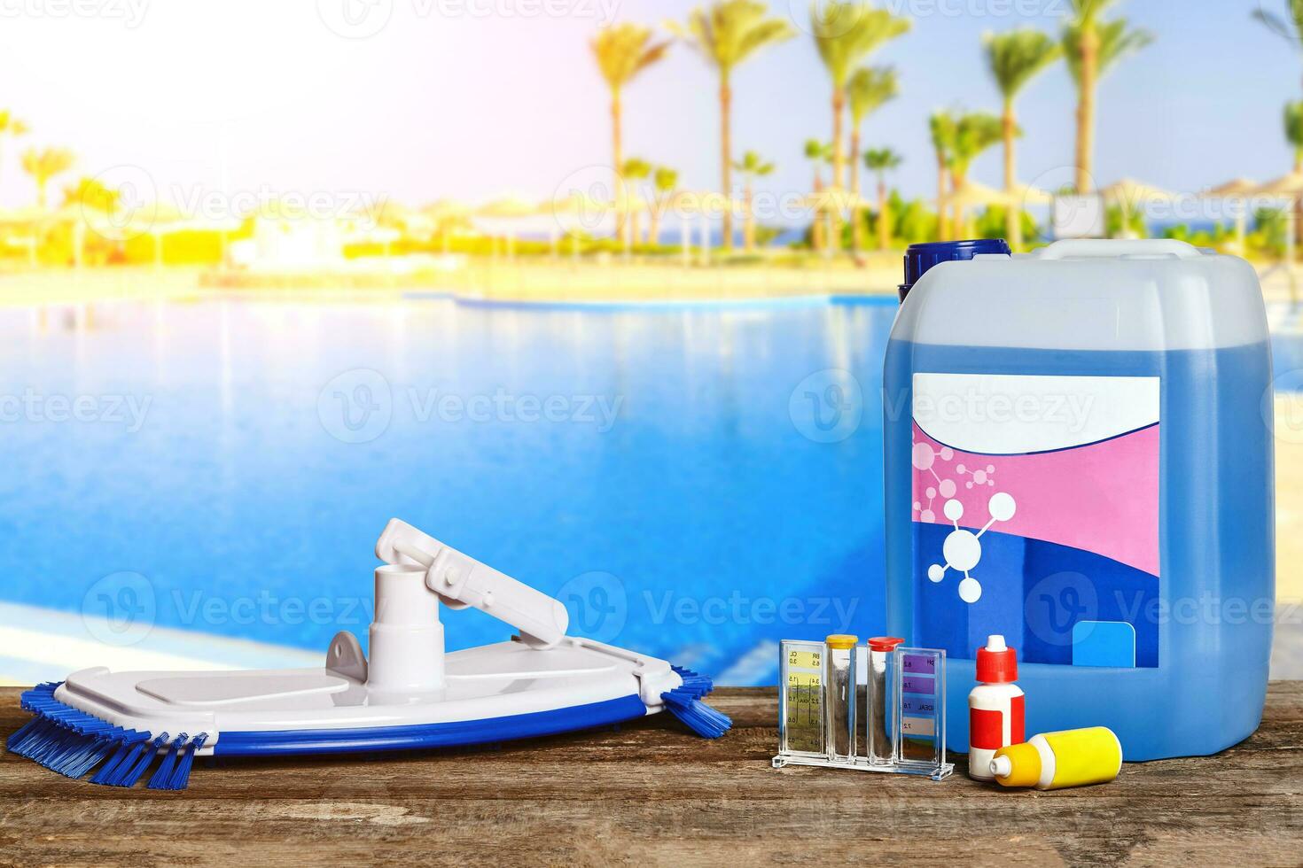 Equipment with chemical cleaning products and tools for the maintenance of the swimming pool. photo