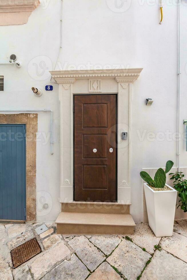 View of the old town of Martina Franca with a beautiful houses painted in white. photo