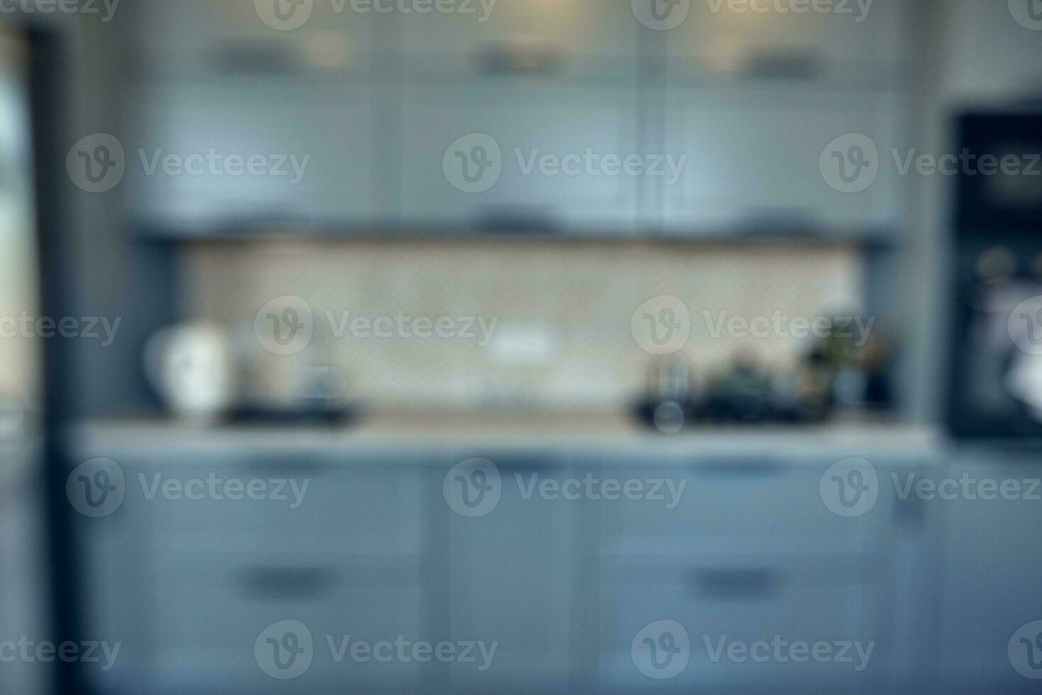 blurred image of modern kitchen interior for background photo