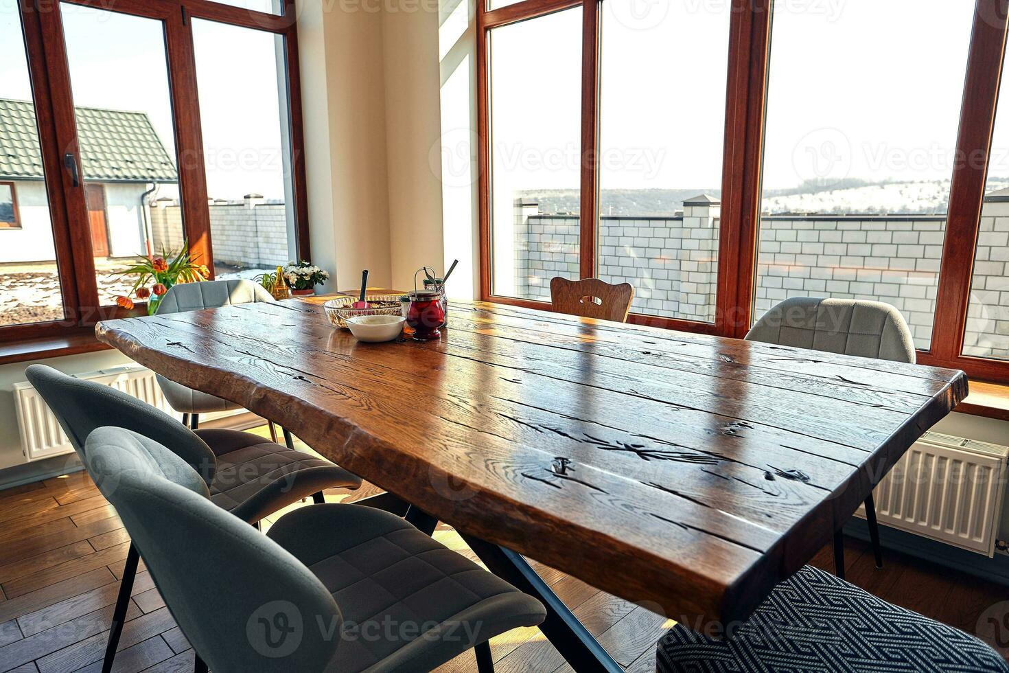 Interior of modern house, dining room with wooden table photo