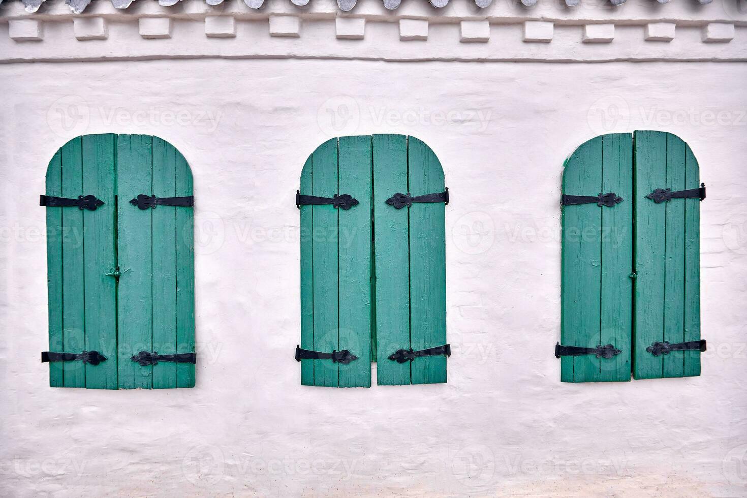 Wooden windows architecture of old wooden houses. Blue wooden window of an old building. photo