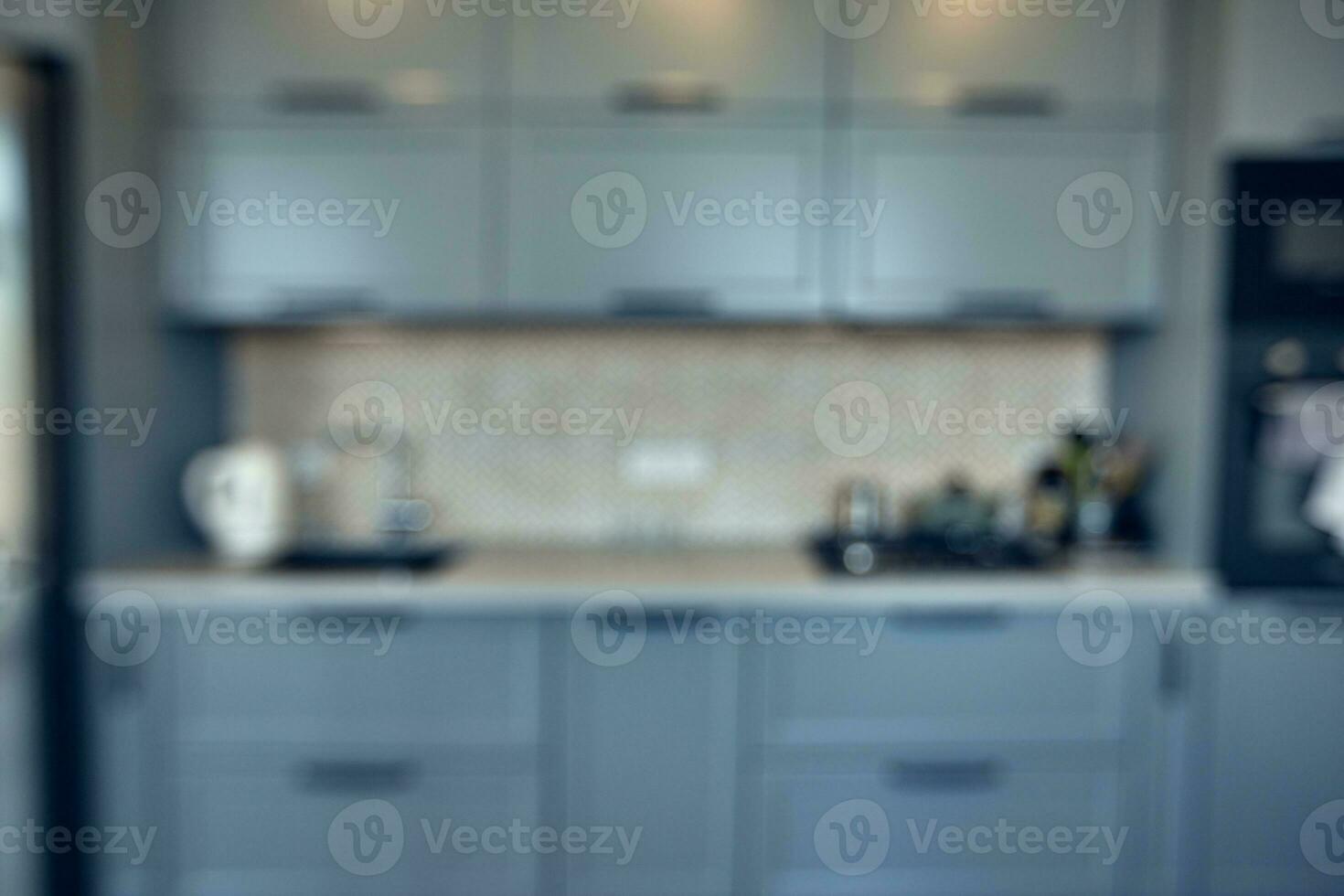 blurred image of modern kitchen interior for background photo