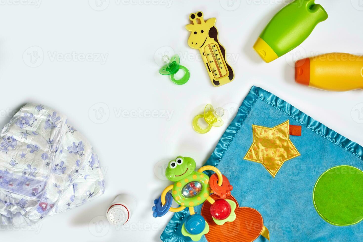 Set of accessories for baby. Pacifier, bottle, diaper, cream on white background. photo