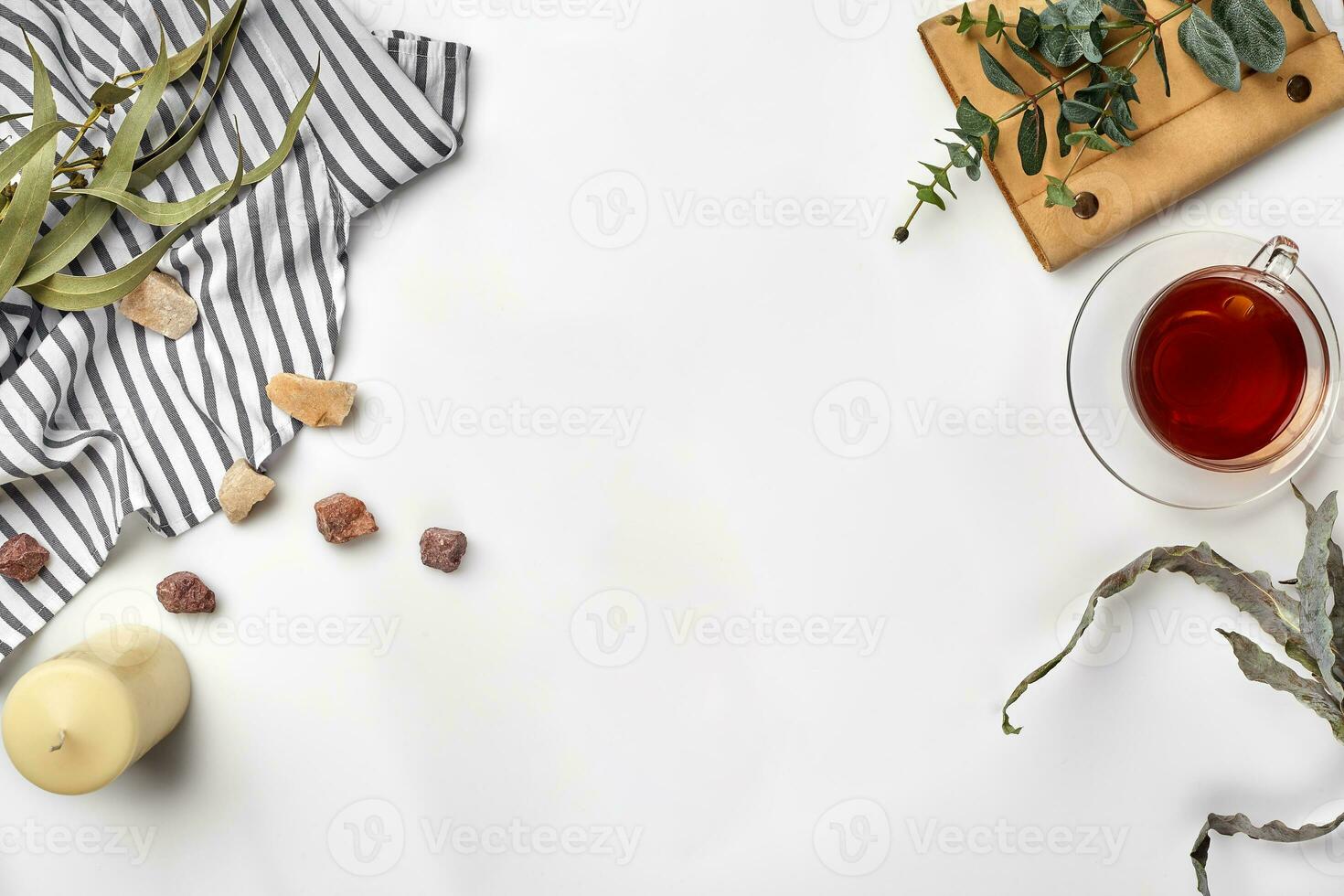 Cup with a ready tea on a white table. Top view, flat lay. Copy space photo