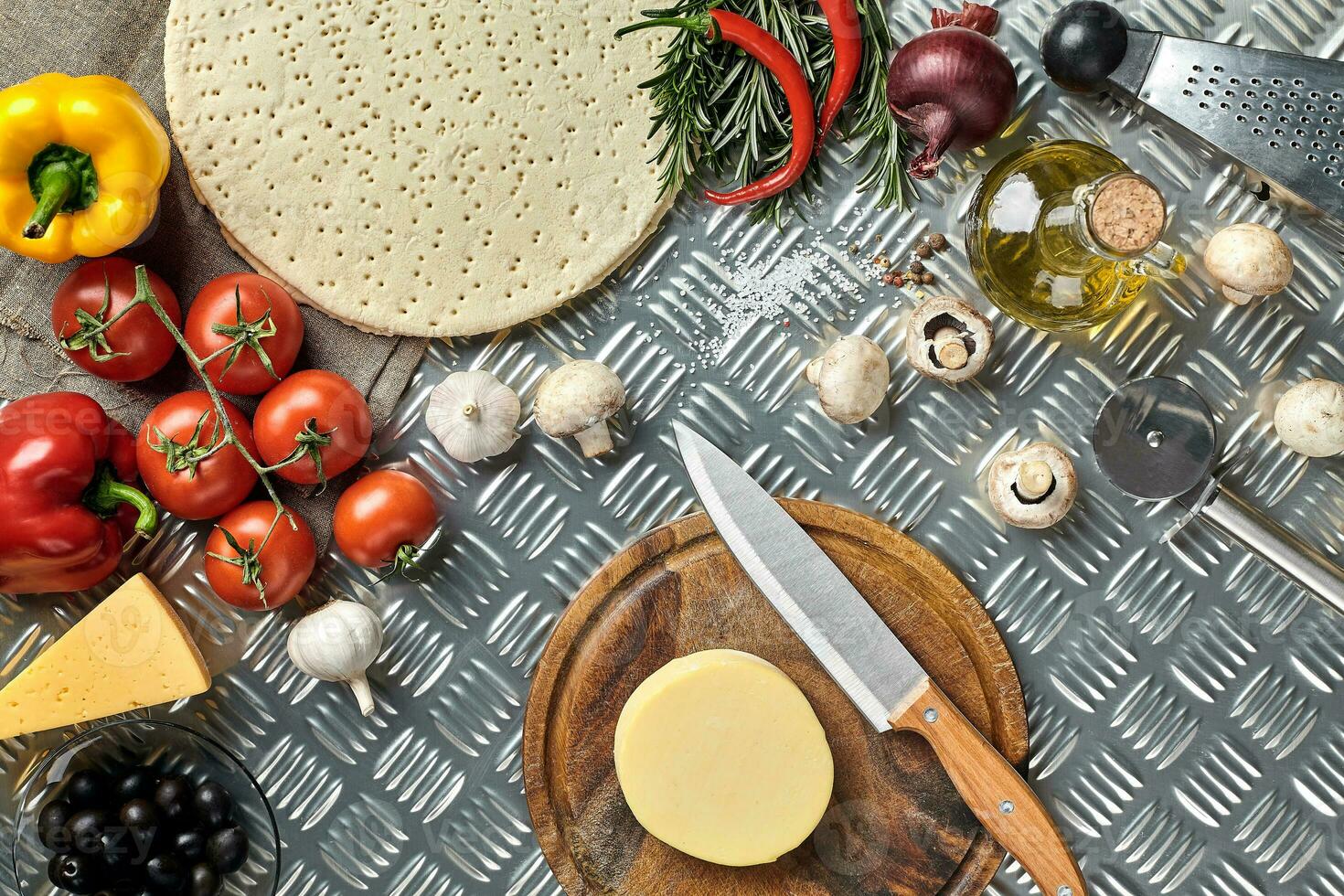 Ingredients for cooking pizza on metal table, top view photo