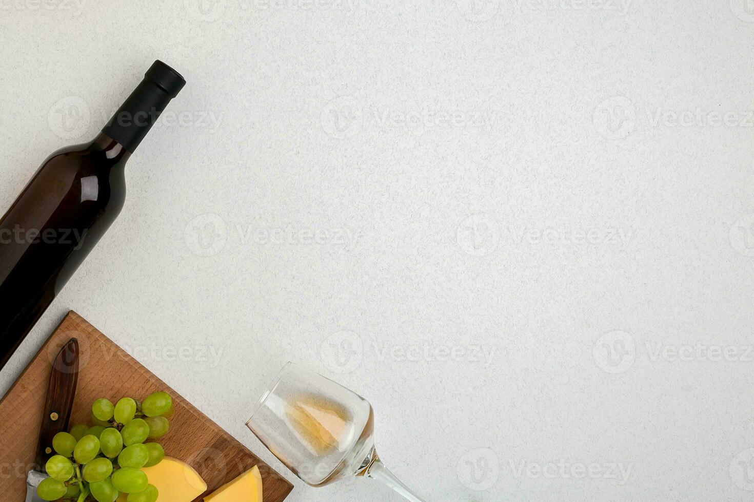 Wine, glasses and corkscrew over white background. Top view photo