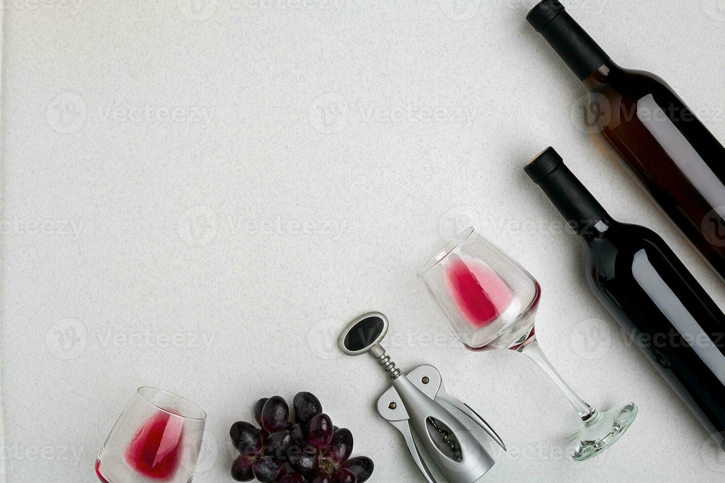 Two glasses of red wine and grapes. Top view photo