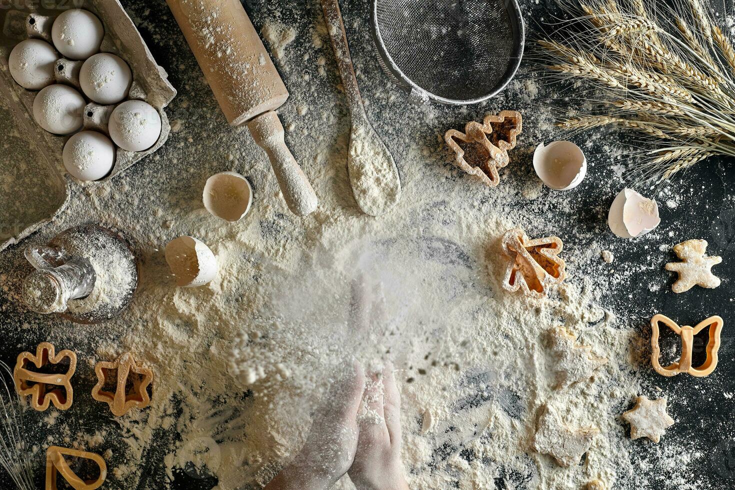 Top view female hands prepares a place for cooking dough photo