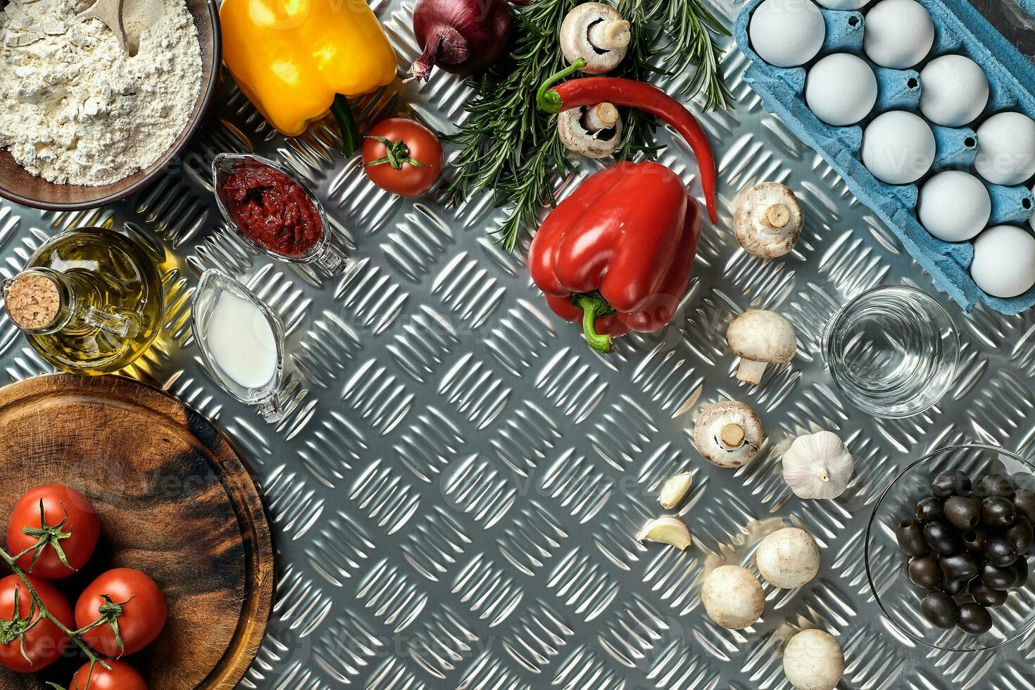 Cooking Pizza. Pizza ingredients on the iron table with copy space, top view. photo