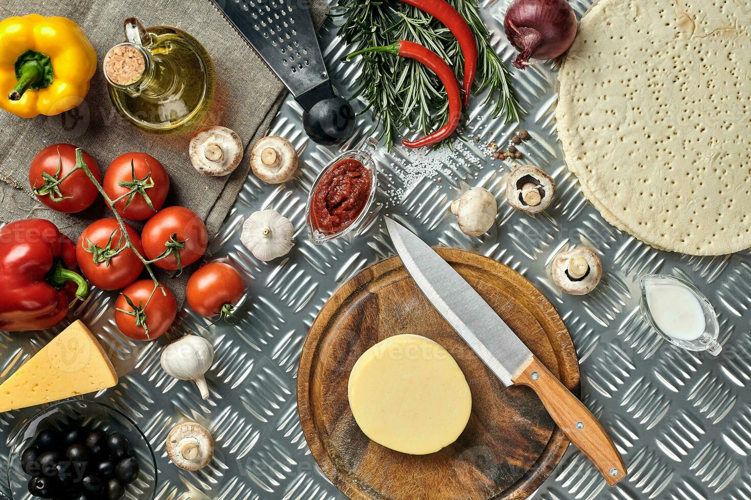 Ingredients for cooking pizza on metal table, top view photo