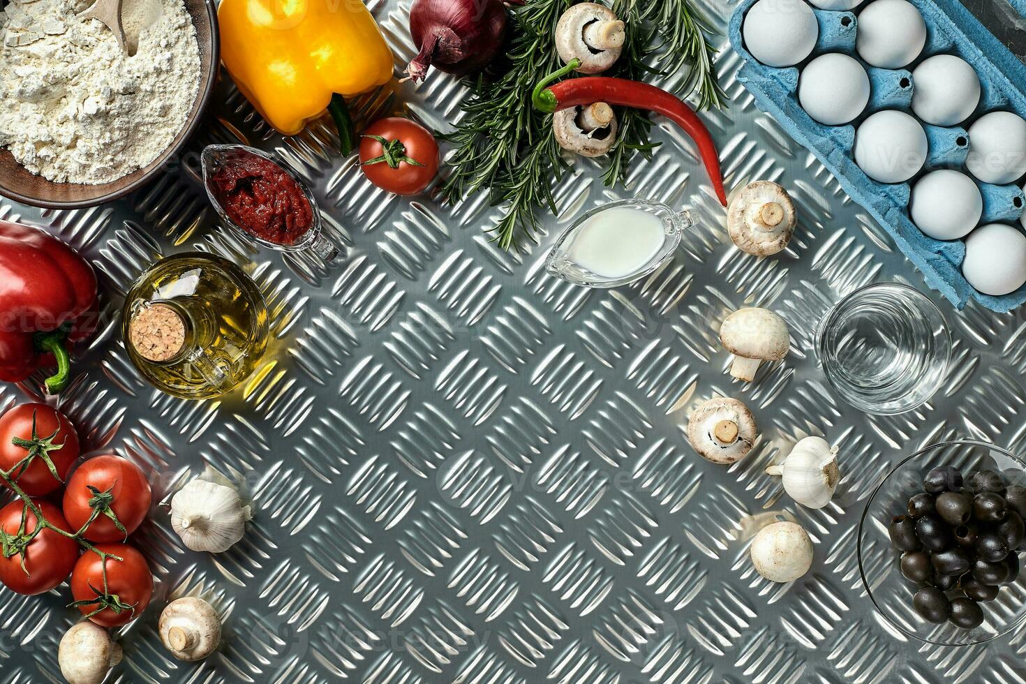 Cooking Pizza. Pizza ingredients on the iron table with copy space, top view. photo