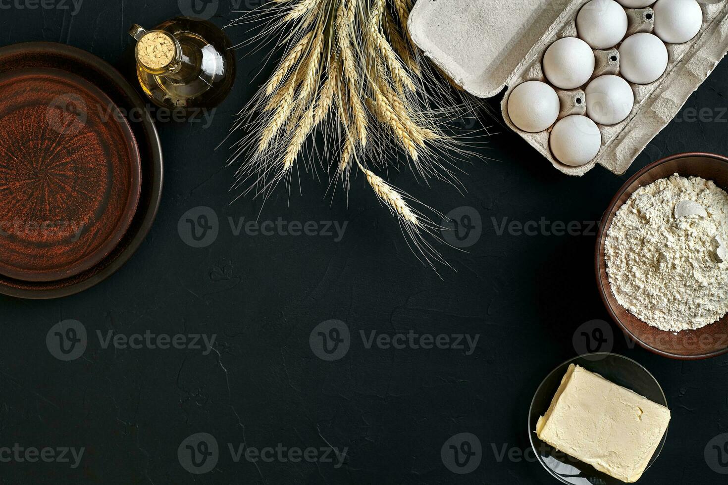 Dough preparation recipe bread, pizza or pie making ingredients, food flat lay on kitchen table background. Working with butter, yeast, flour, eggs, oil. Pastry or bakery cooking. photo