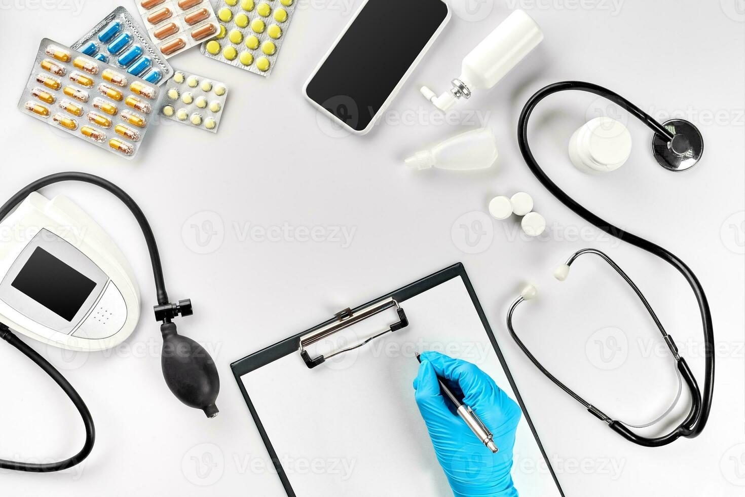 Doctor s table, tools, medical instruments, therapist tonometer, blood pressure, work in hospital on white background flat lay photo