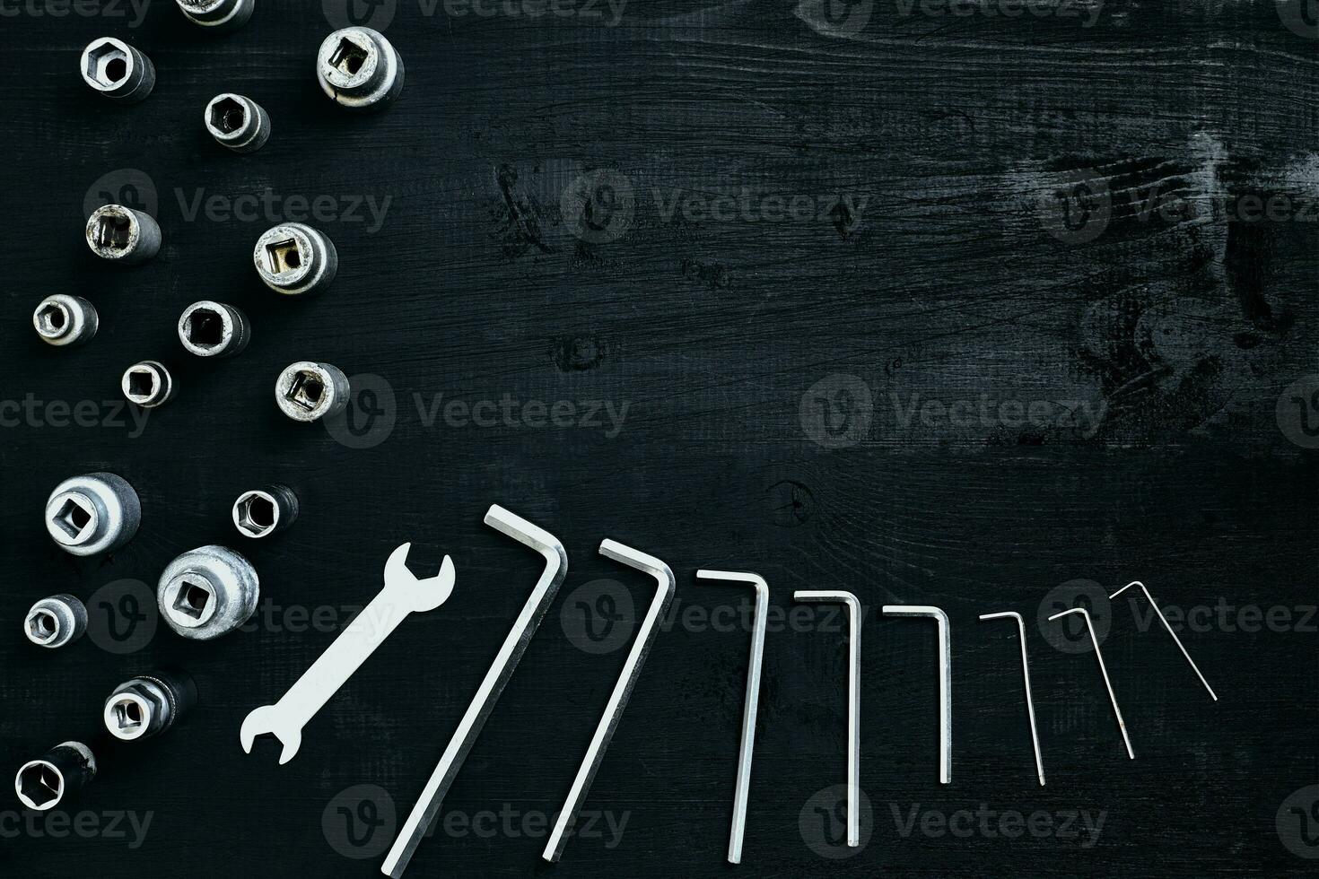 Tools for work or repair auto on black wooden background. Top view photo