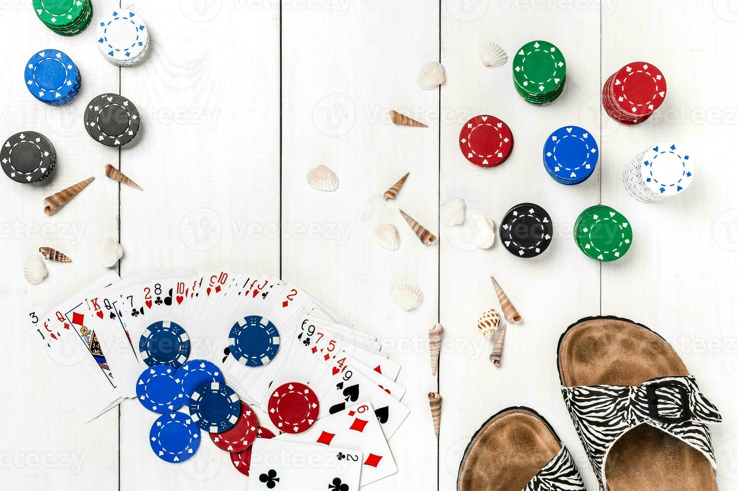 Gambling. Poker chips, cards and slippers on wooden table. Top view. Copyspace. Poker photo