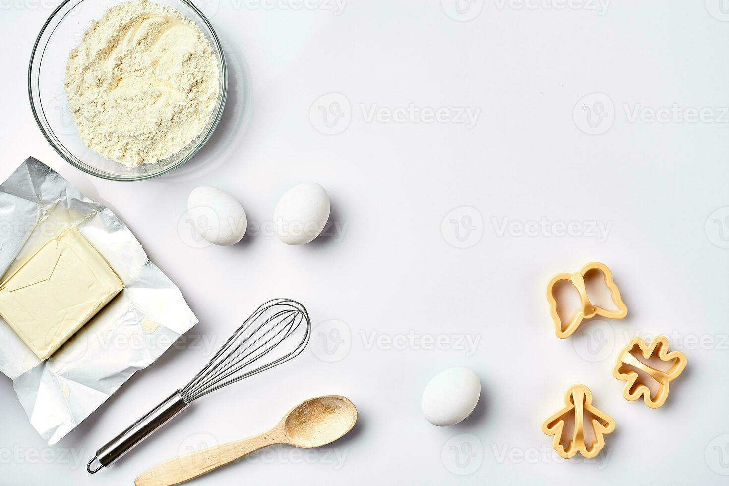 Preparation of the dough. Ingredients for the dough flour, butter, eggs and various tools. On white background. Free space for text . Top view photo