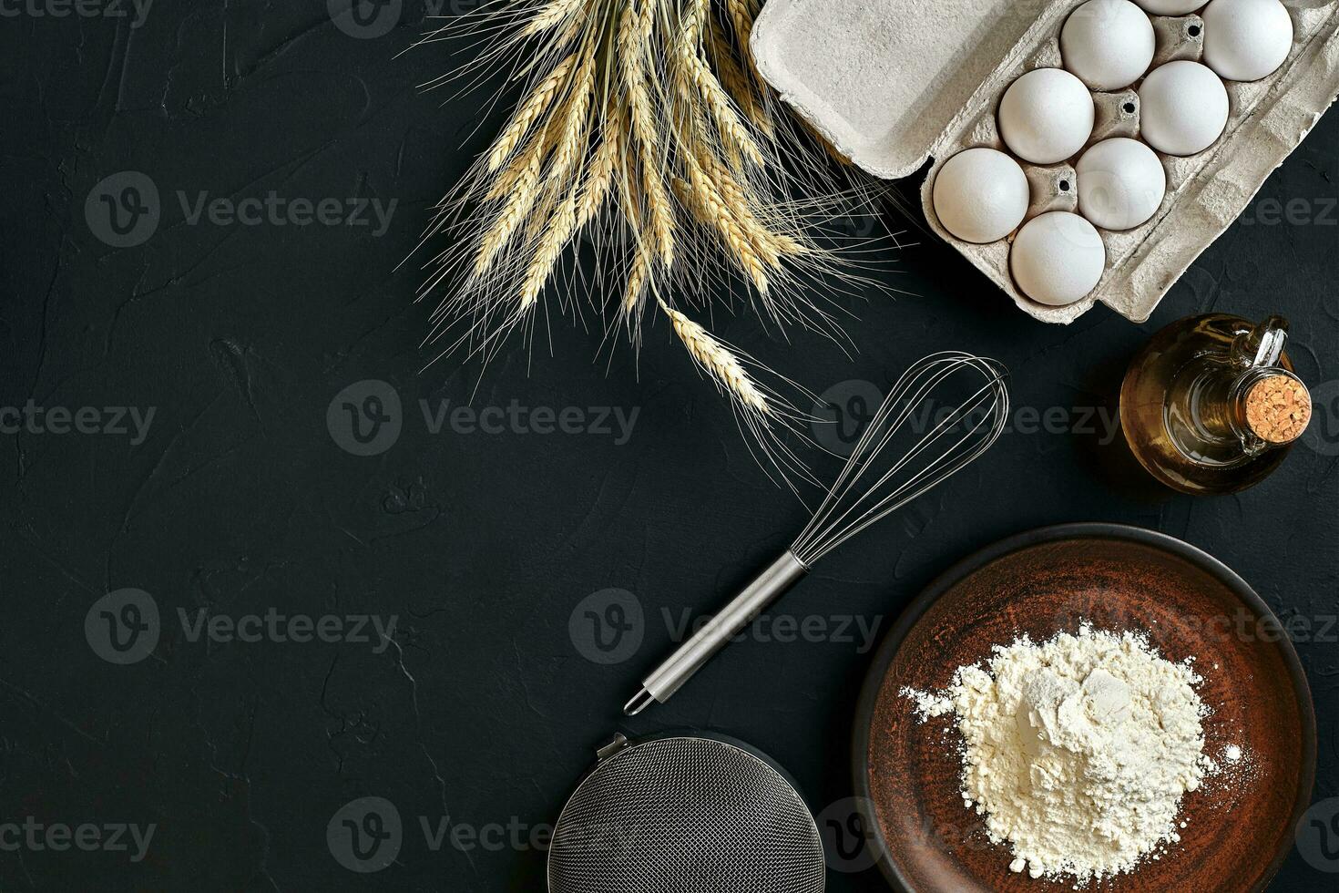 Preparation cooking baking kitchen table brown dishes ware fresh grocery different ingredients eggs, flour, oil, stuff top view photo