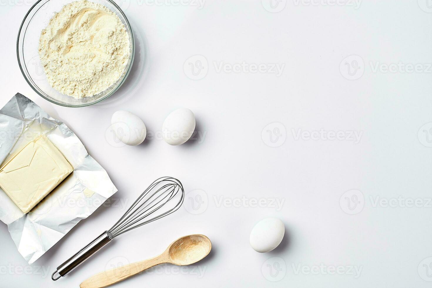 Preparation of the dough. Ingredients for the dough - flour, butter, eggs and various tools. On white background. Free space for text . Top view photo