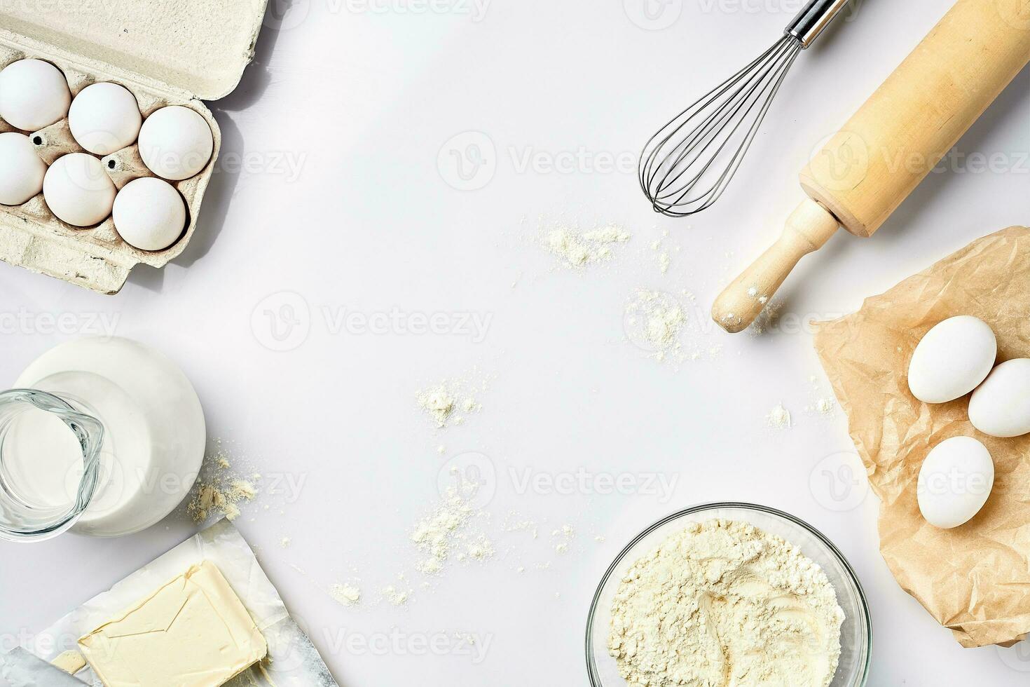 Preparation of the dough. A measurement of the amount of ingredients in the recipe. Ingredients for the dough flour, eggs, rolling pin, whisk, milk, butter, cream. Top view, space for text photo