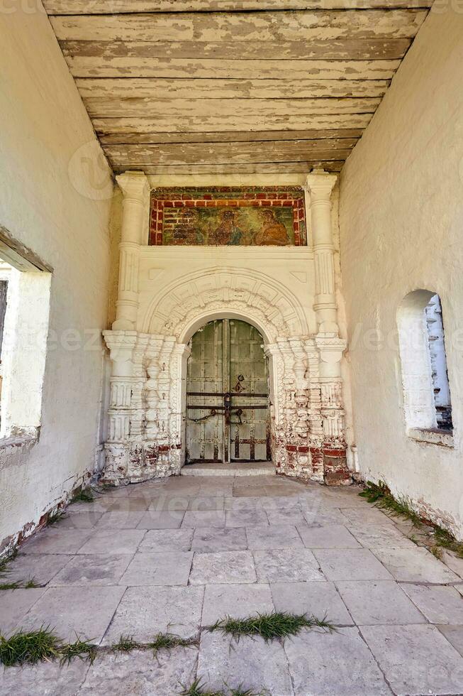 Locked wooden door of the old orthodox church photo