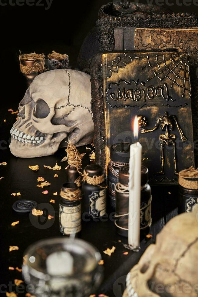 Realistic model of a human skull with teeth on a wooden dark table, black background. Medical science or Halloween horror concept. Close-up shot. photo