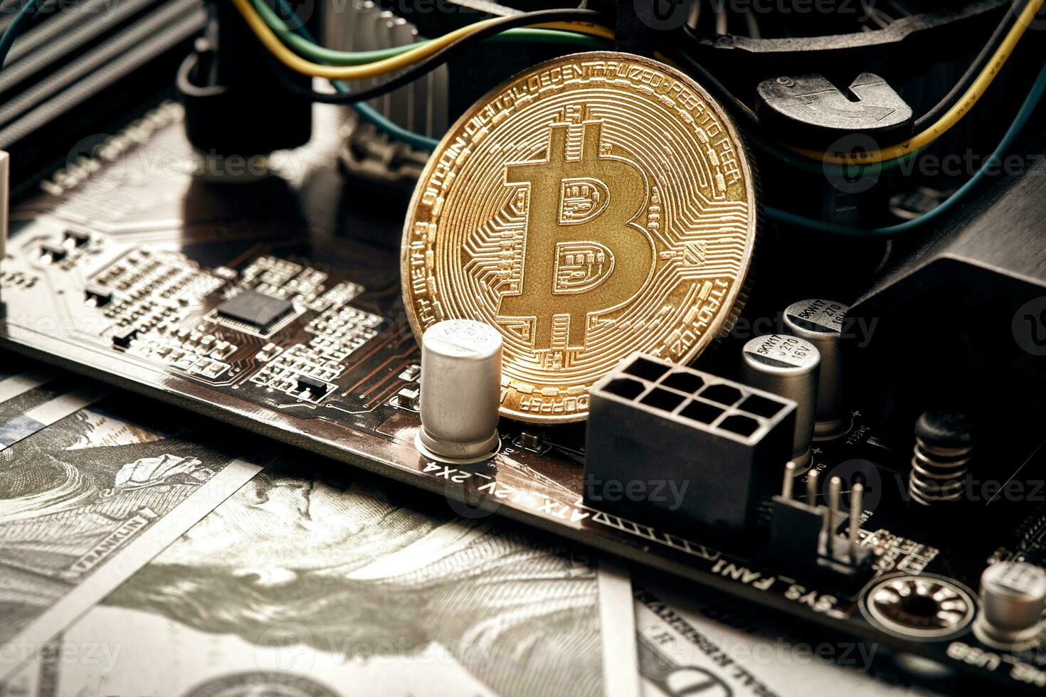 The coin of bitcoin lies on video card with dollars. Exchange bitcoin cash for a dollar photo