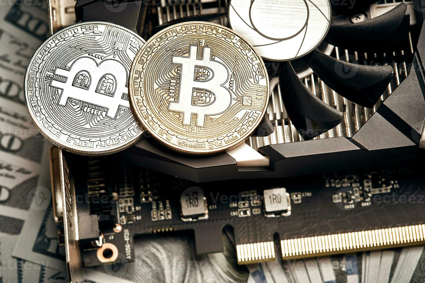 The coin of bitcoin lies on video card with dollars. Exchange bitcoin cash for a dollar photo