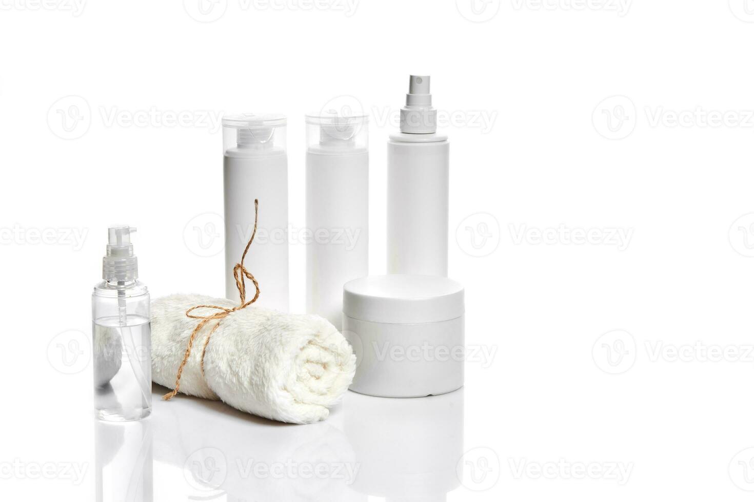 Set of cosmetic products in white containers on light background. photo