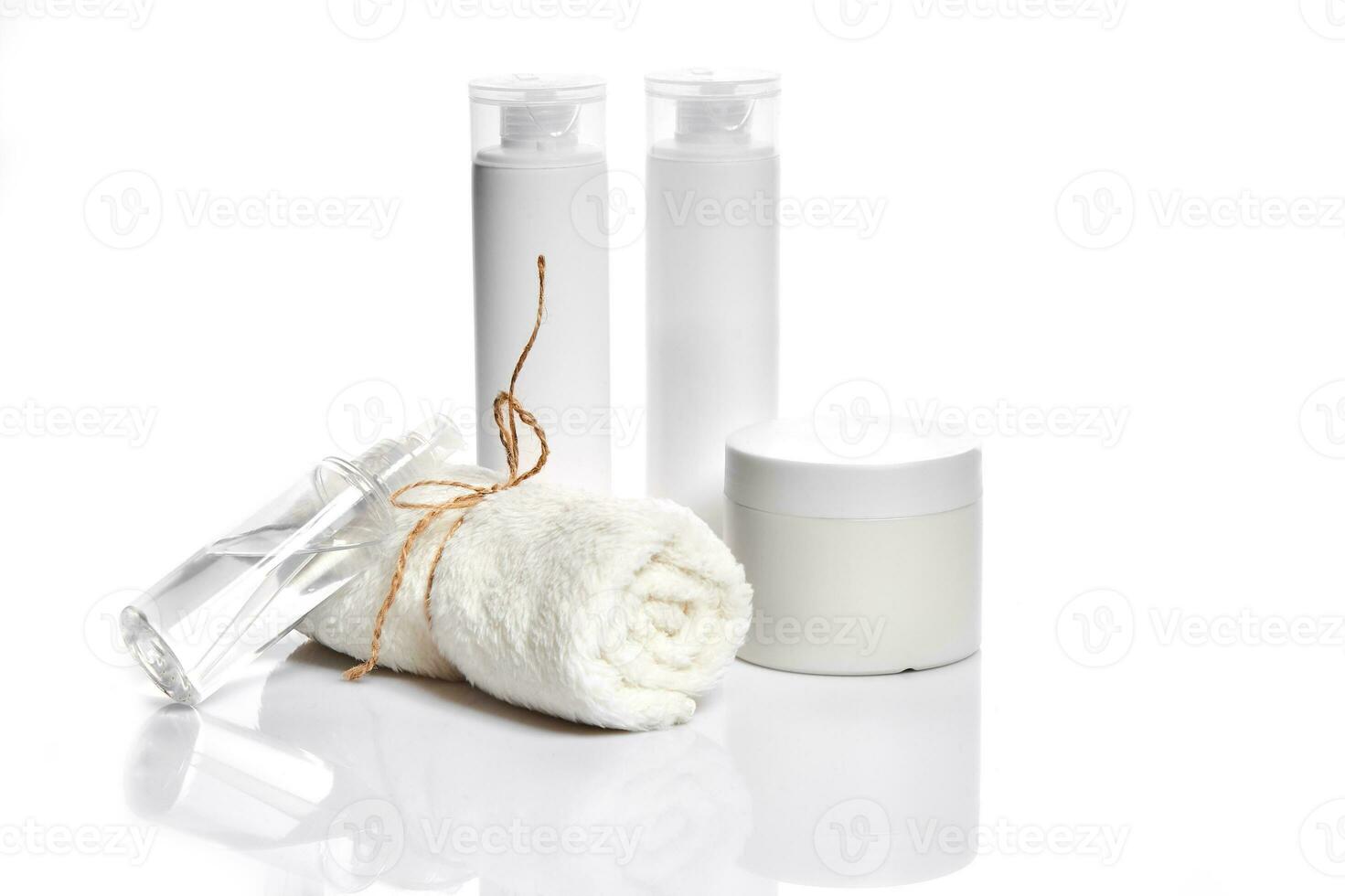 Set of cosmetic products in white containers on light background. photo