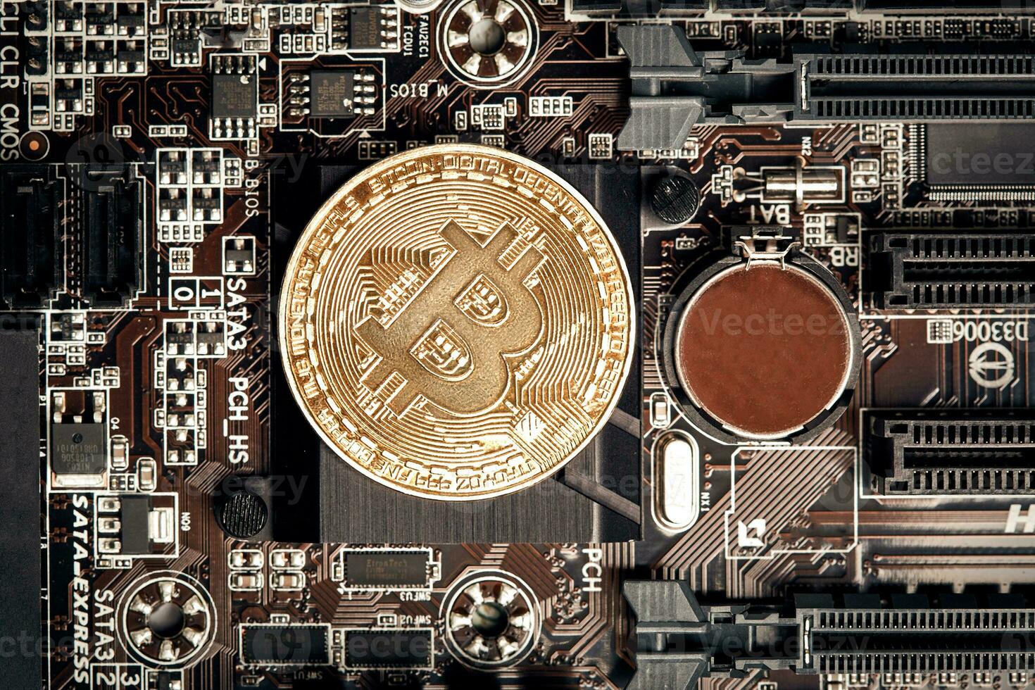 Bitcoin. New virtual money. Bitcoins lie on the video card, concept of mining. photo