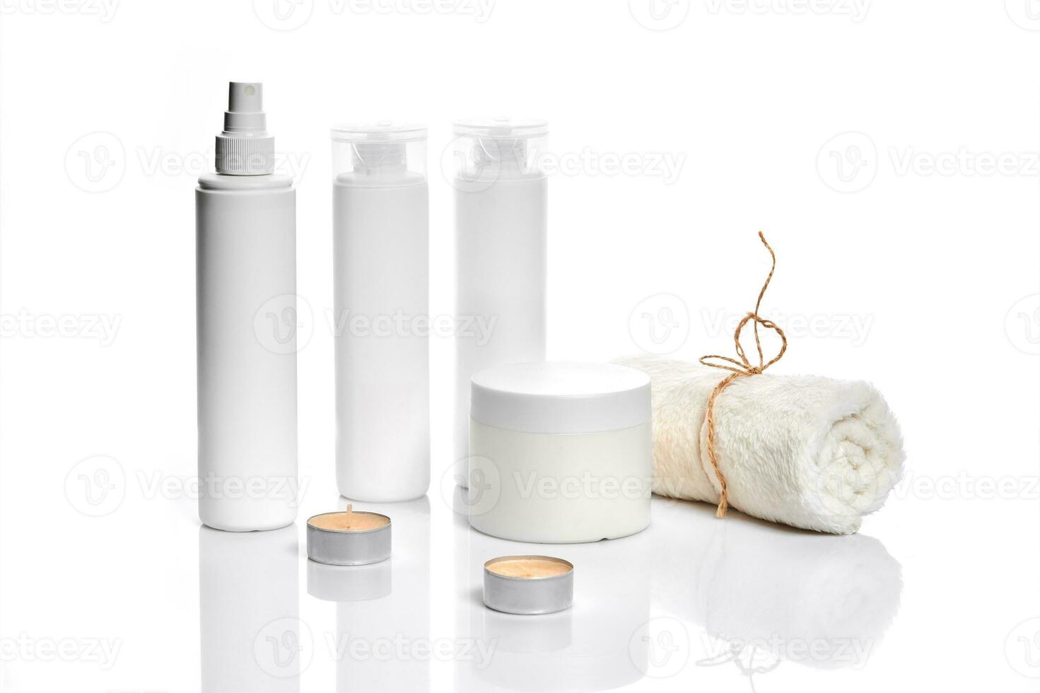 Set of cosmetic products in white containers on light background. photo