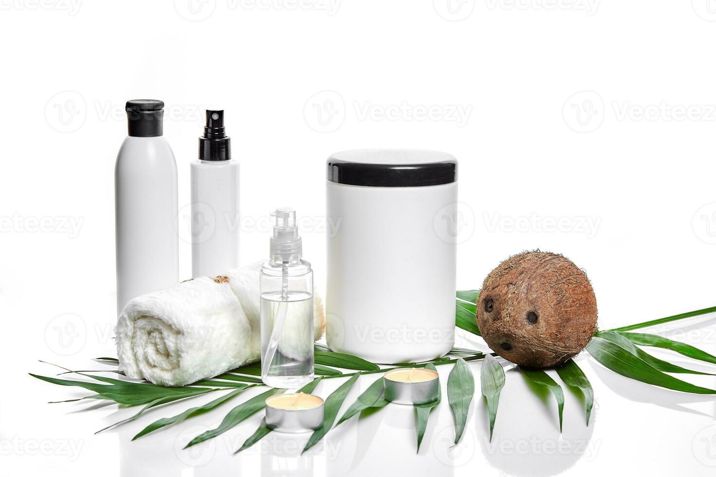 Organic cosmetics with coconut on white background. photo