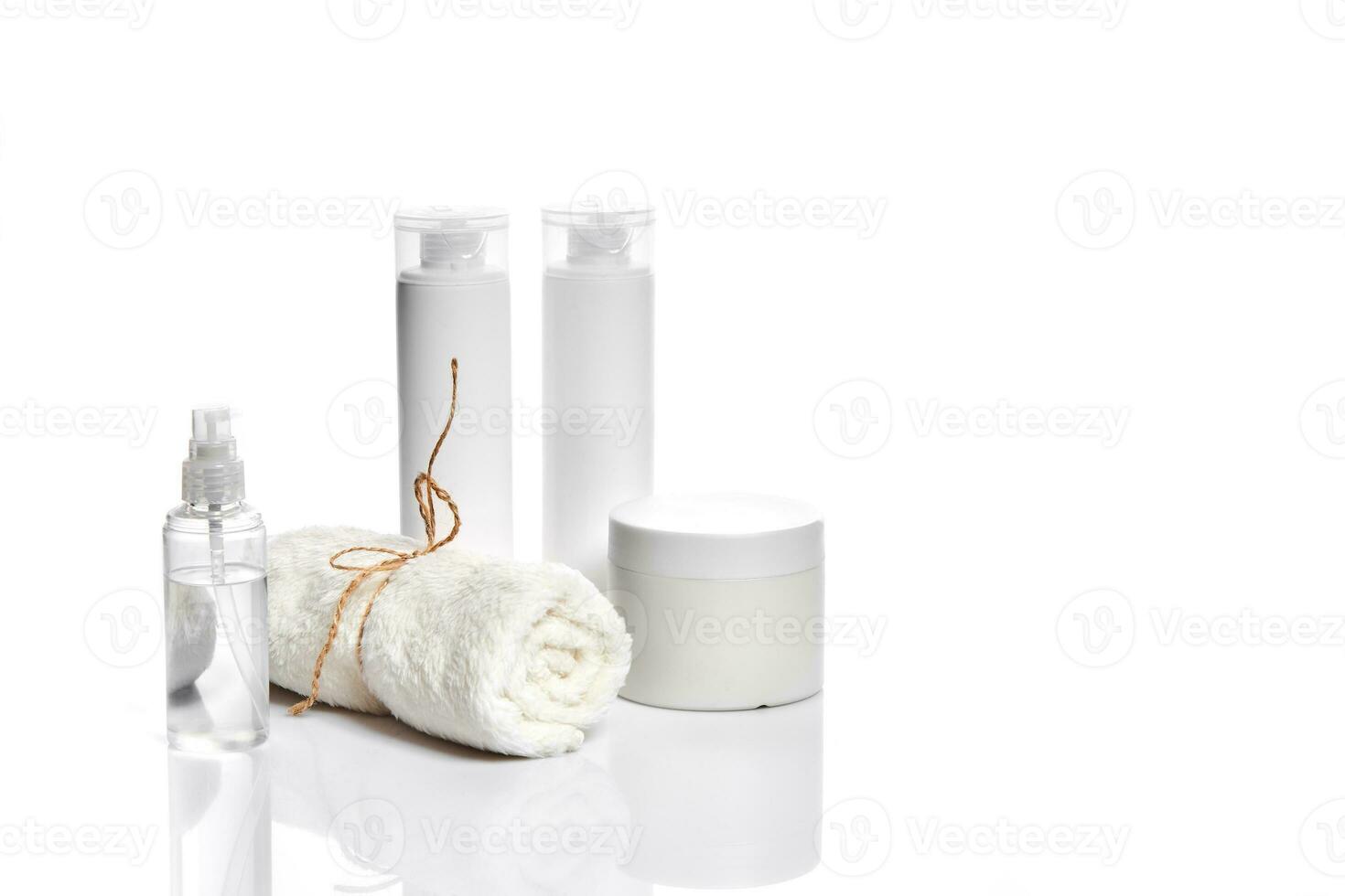 Set of cosmetic products in white containers on light background. photo