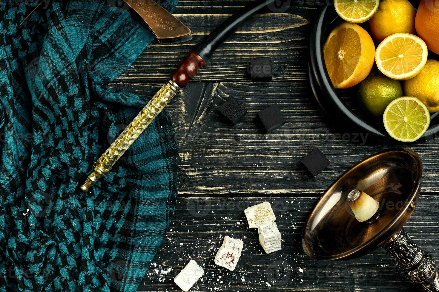 Stylish Smoking hookah and basket with lemon, lime and orange on photo