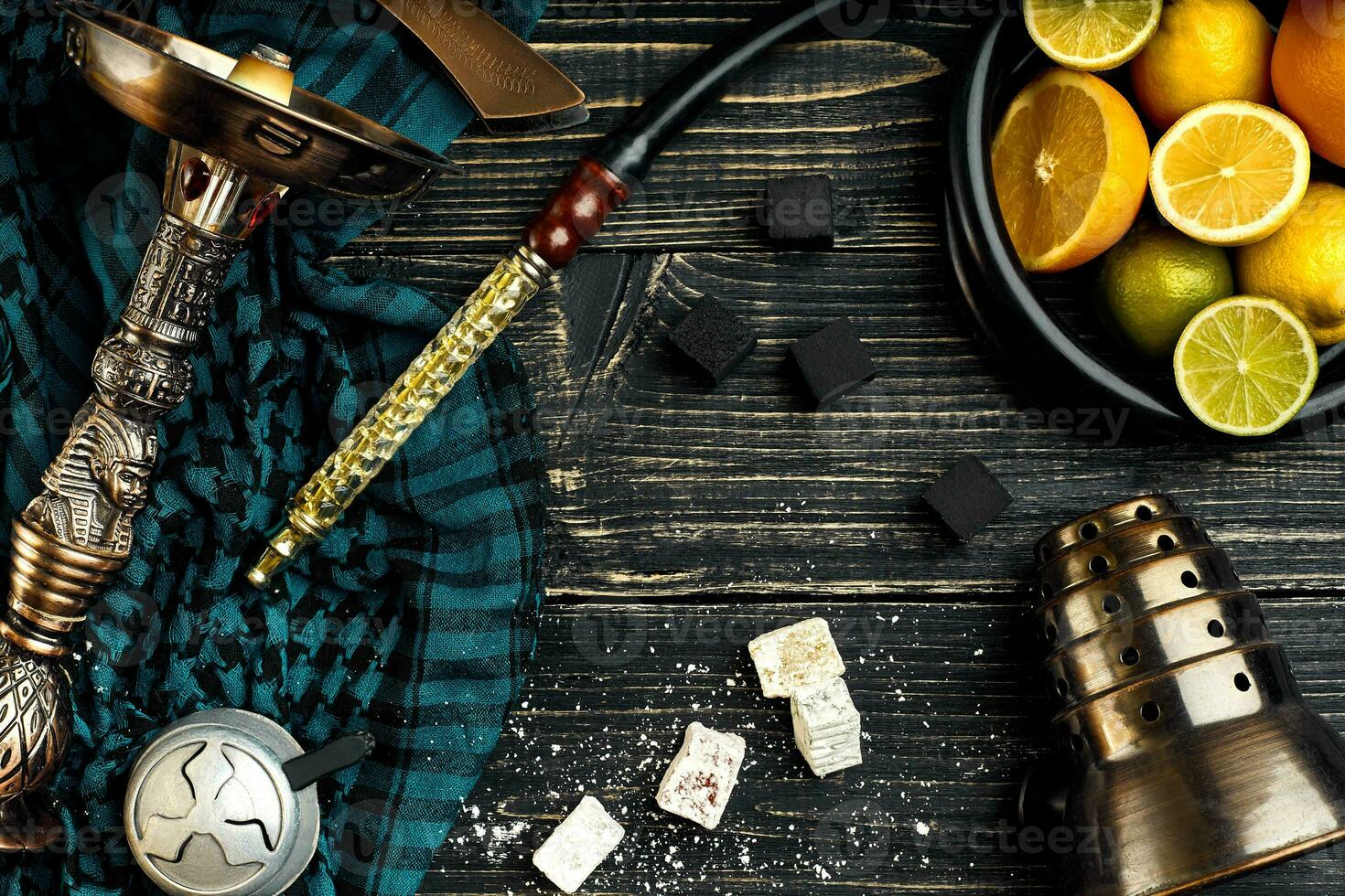 Stylish Smoking hookah and basket with lemon, lime and orange on photo