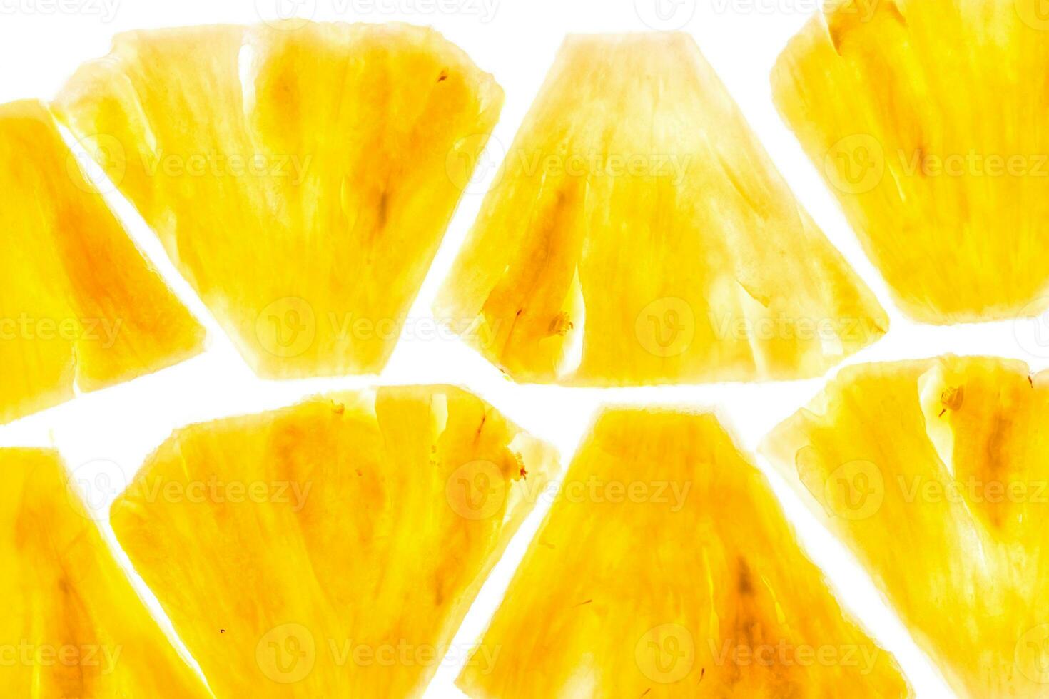 Pineapple chunks isolated on white background photo