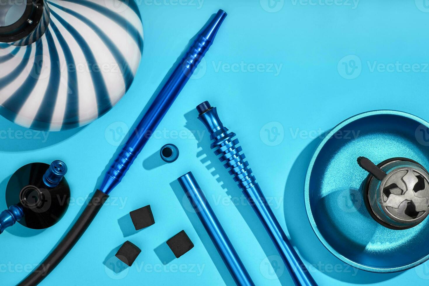 Top view of Hookah parts on light blue background photo