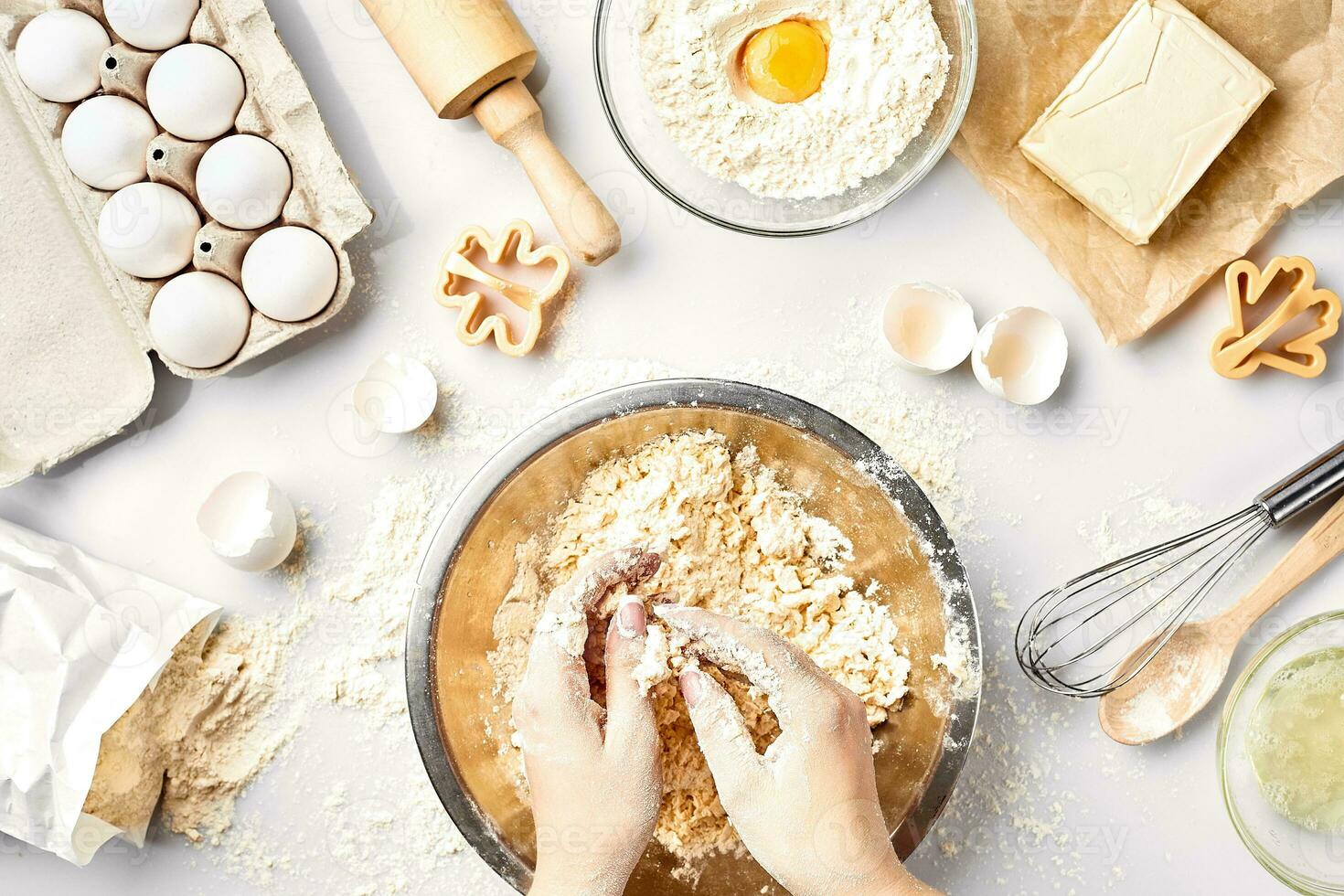 Baker preparing to knead the dough, top view. Cooking, bakery concept photo