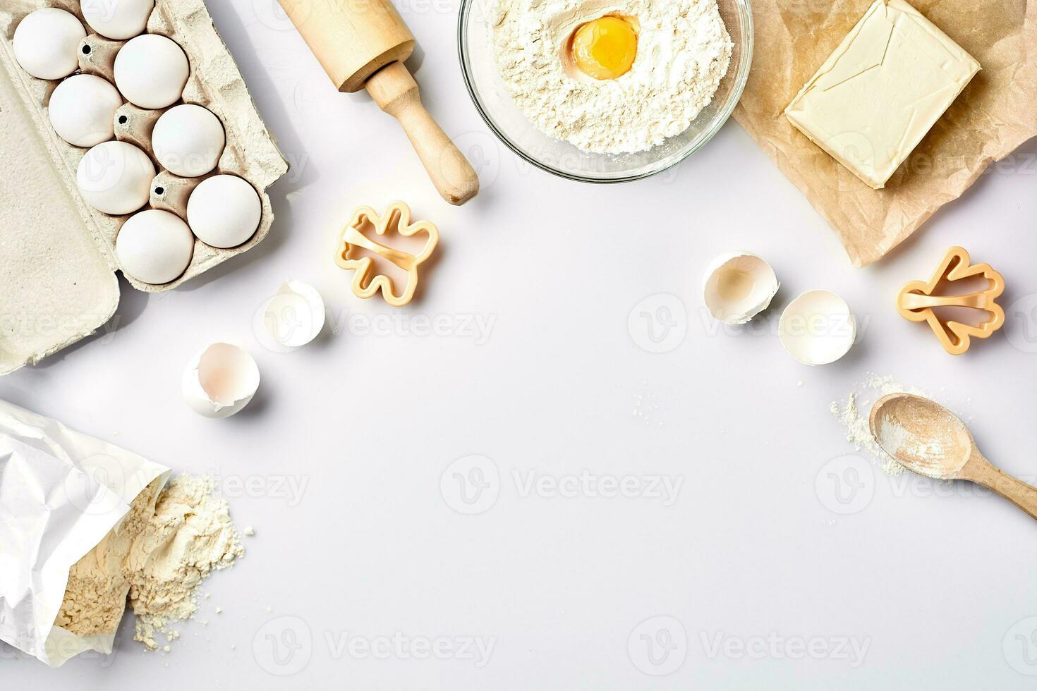 Baking ingredients for pastry on the white table photo