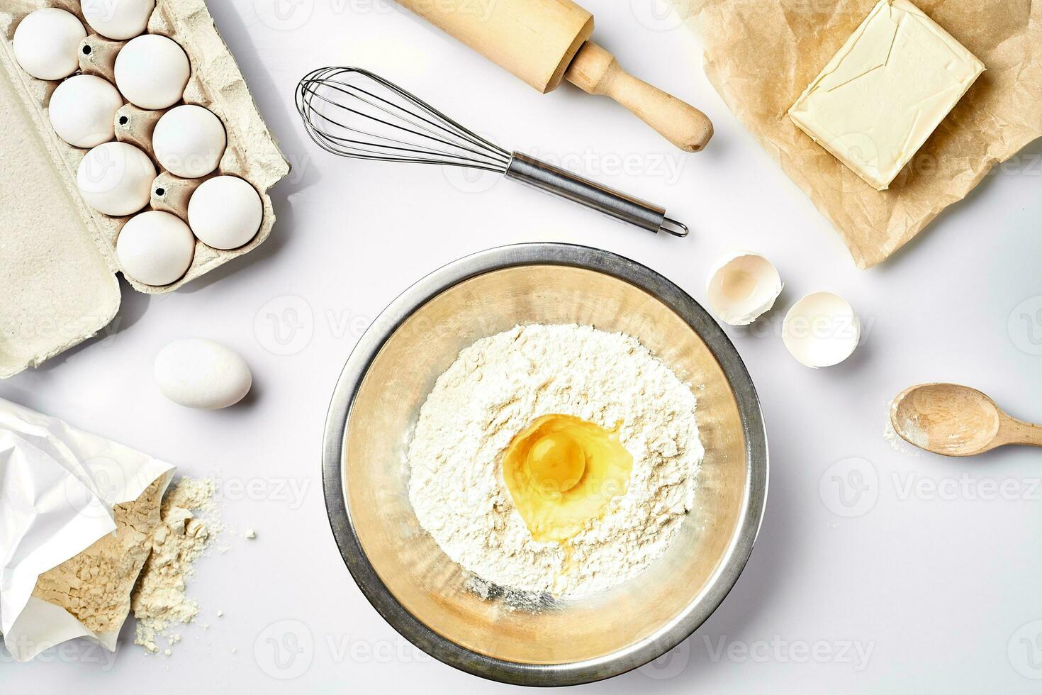 Baking ingredients for pastry on the white table photo