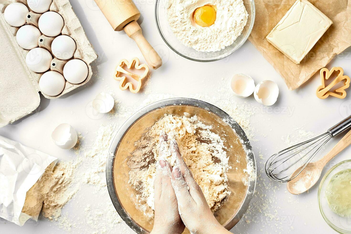 Baker preparing to knead the dough, top view. Cooking, bakery concept photo