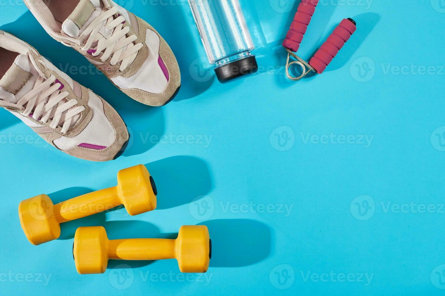 Female sport shoes and equipment top view, copy space. Active lifestyle, body care concept. photo