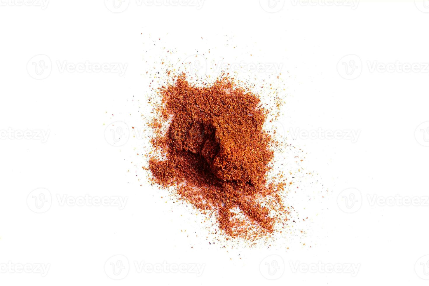 Crushed red pepper chilli pile from top on white background photo