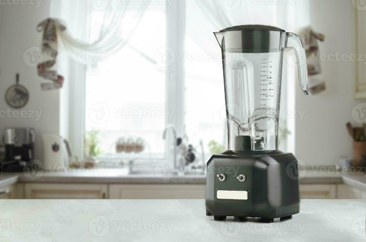 Blender and wooden table in kitchen photo