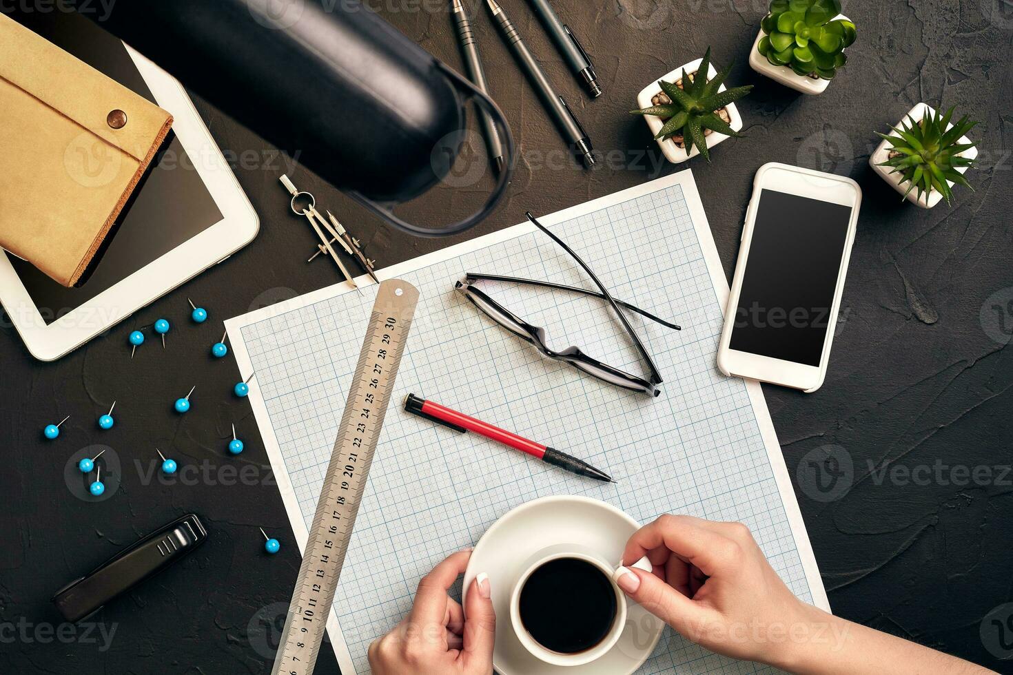 Architect working on blueprint. Architects workplace - architectural project, blueprints, tablet pc. Engineering tools. Top view photo
