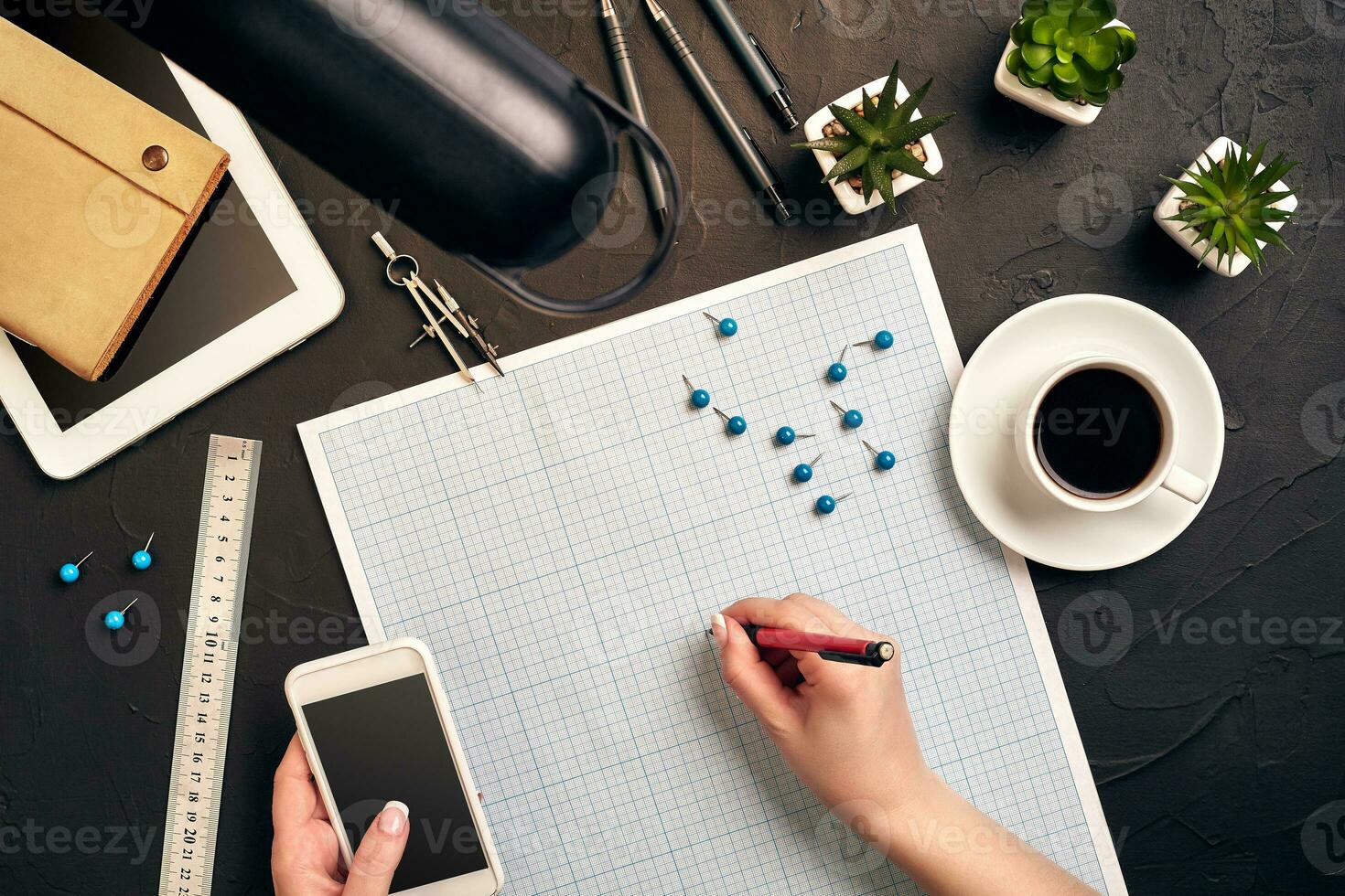 Architect working on blueprint. Architects workplace - architectural project, blueprints, tablet pc. Engineering tools. Top view photo