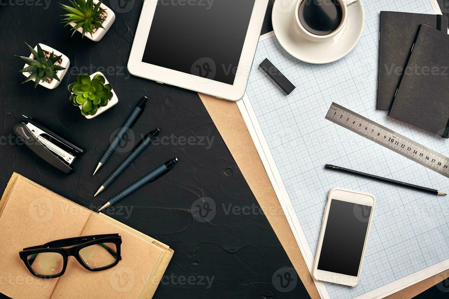 Architect's work tools on black background. Top view photo